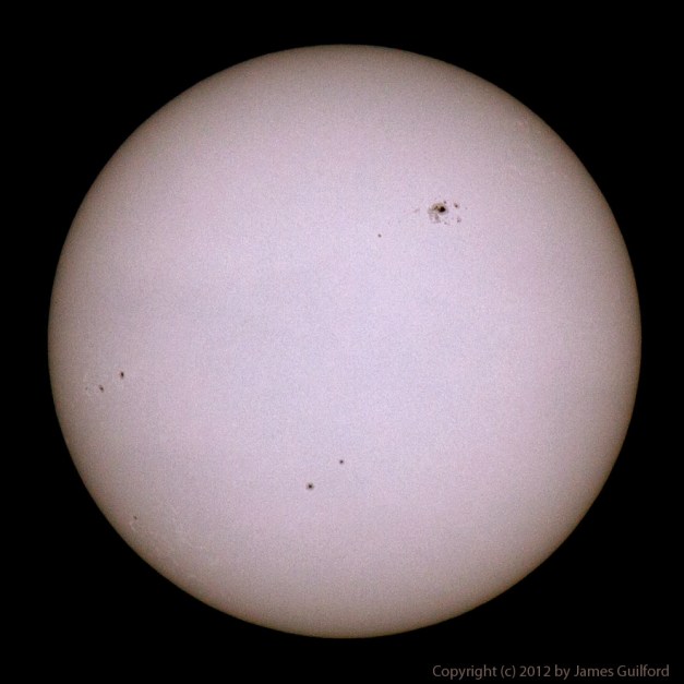 Photo: The Sun with sunspots and other details visible. Photo by James Guilford.