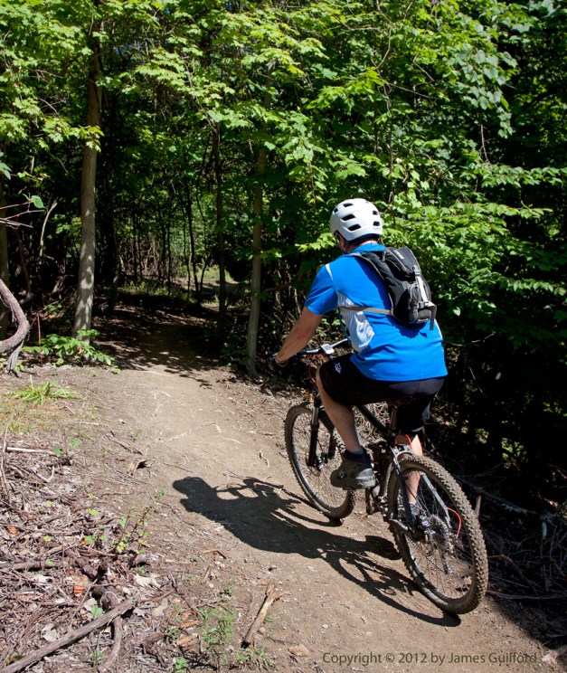 Photo: Mountain biker on single-track trail. Photo by James Guilford.