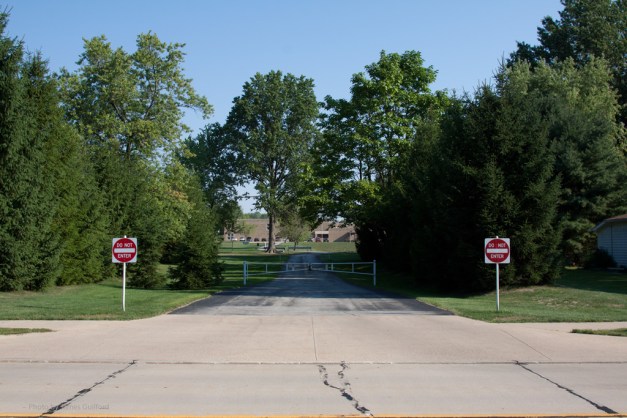 Photo: Driveway with gates and do not enter signs. Photo by James Guilford.