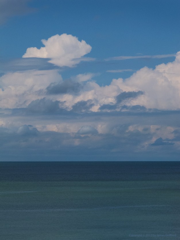 Photo: Clouds moving over colorful waters of Lake Erie in Ohio. Photo by James Guilford.
