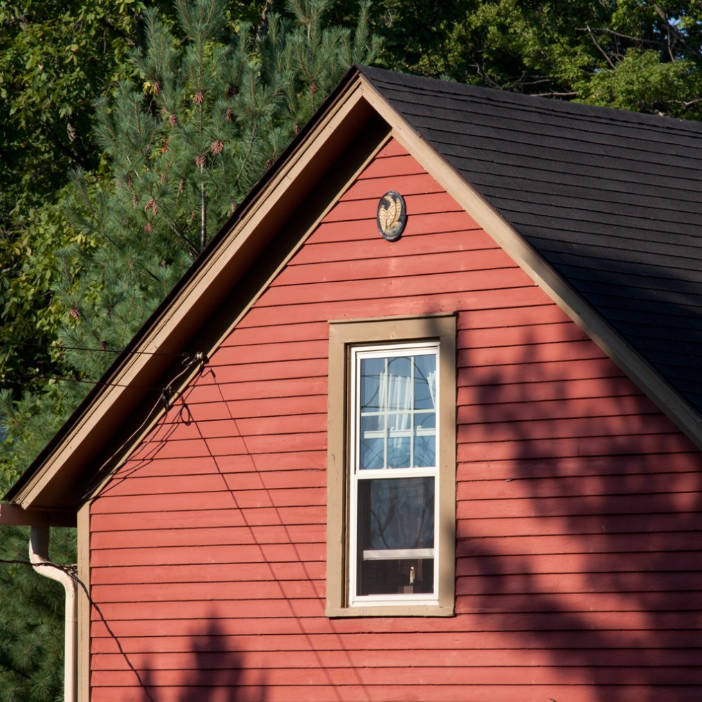 Photo: Red house in morning sunlight. Photo by James Guilford.