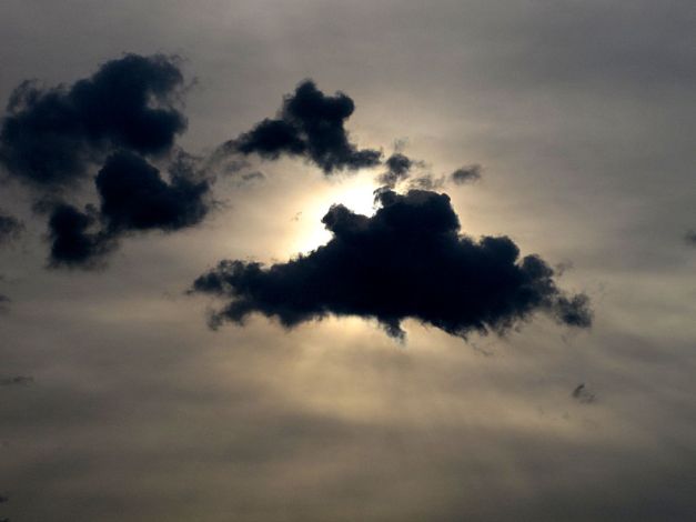 Photo: Dark clouds obscure the morning sun. Photo by James Guilford.