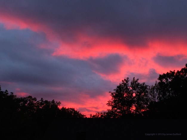 Photo: Brilliant sunset on a stormy evening. Photo by James Guilford.