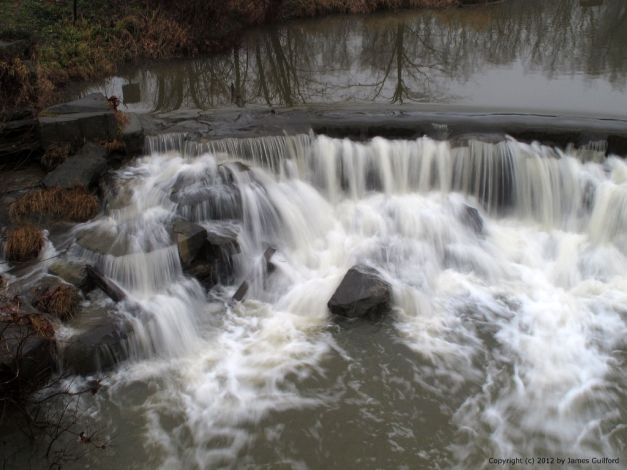 Photo: Water over a dam. Photo by James Guilford.