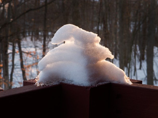 Photo: Wind and thaw shaped pile of snow.