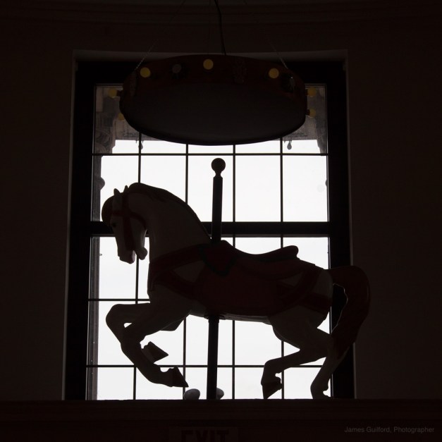 Photo: Silhouette of a carousel horse.