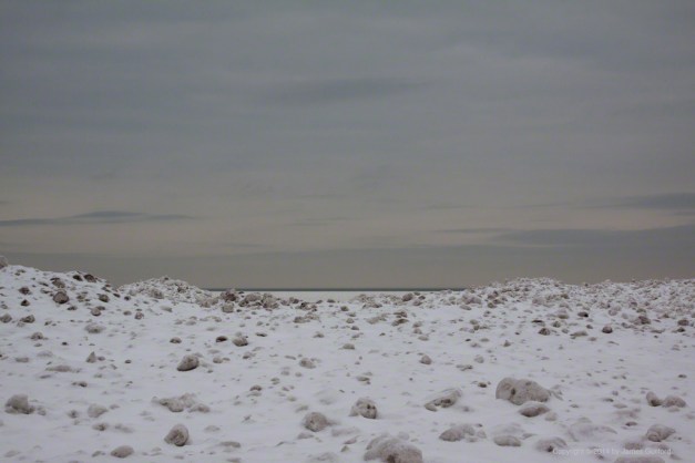 Photo: Ice piled on a Lake Erie beach. Photo by James Guilford.