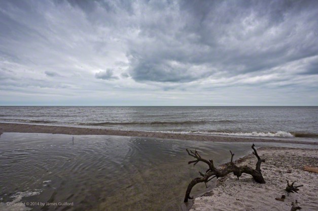 Photo: Calm Lake Erie with Gloomy Clouds Overhead. Photo by James Guilford