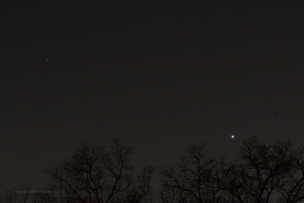 Photo: Planet Venus between the Hyades and Pleiades star clusters. Photo by James Guilford.