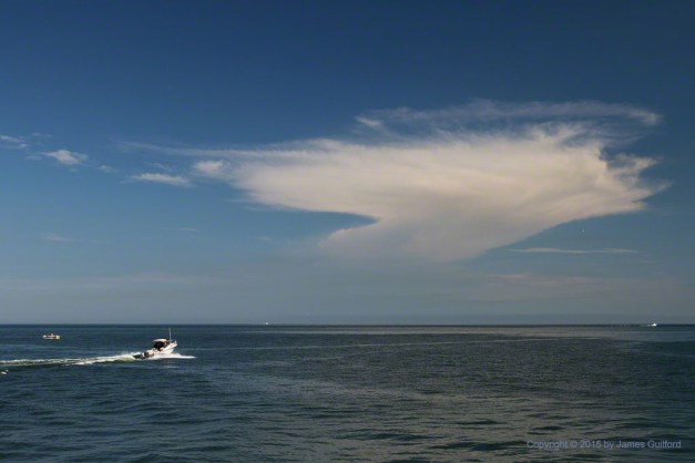 Photo: Storm cloud over Lake Erie with speed boat heading out. Photo by James Guilford.