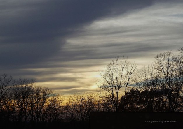 Photo: Streaked clouds in approaching sunset. Photo by James Guilford.