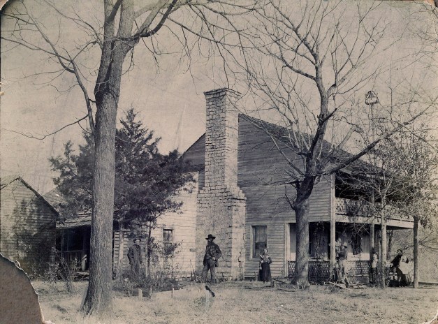 Photo: Antique photo of family and their home in War Eagle, Arkansas.