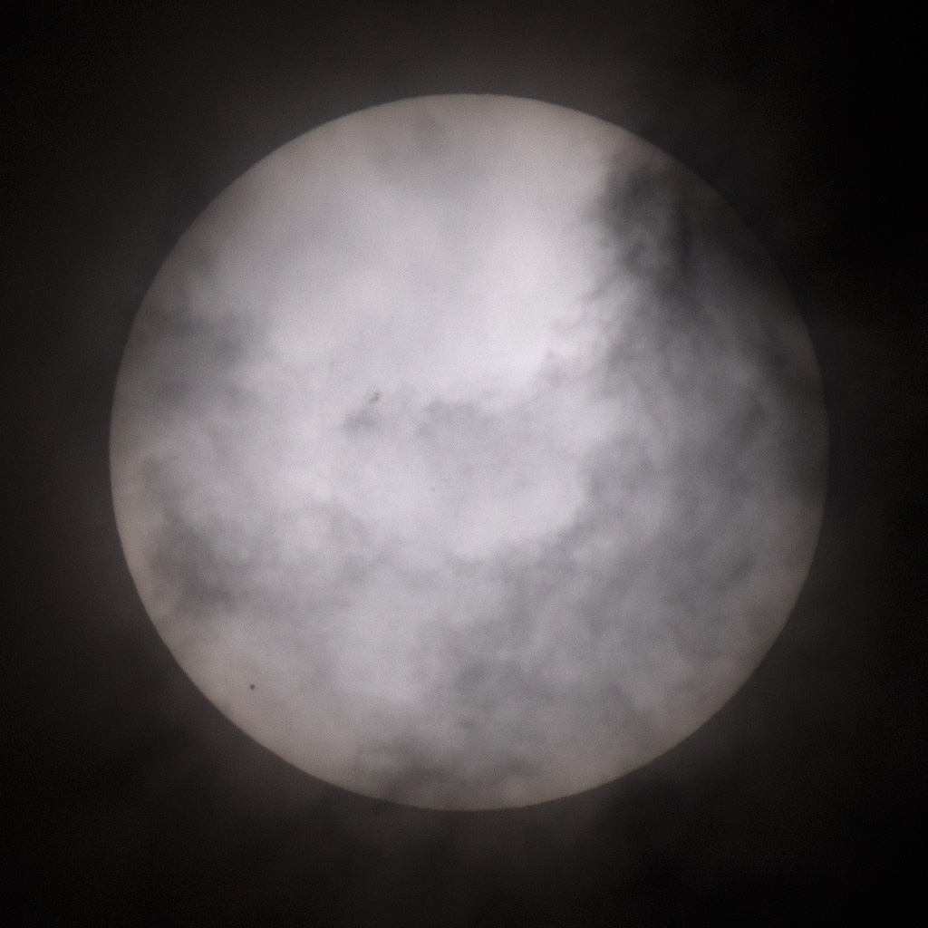 Photo: Clouds interfere with view of Mercury's transit. Photo by James Guilford.