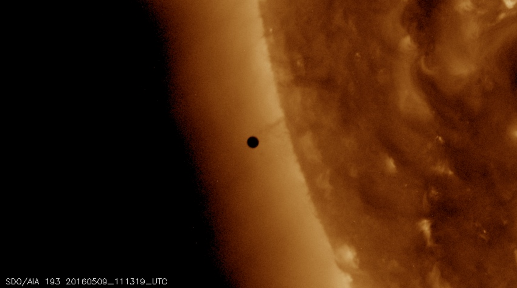 Photo: Transit of Mercury about to begin, seen from space. 