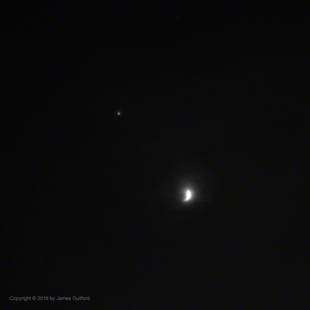 Photo: Clouds Moving In, beginning to cover the Moon and Jupiter. Photo by James Guilford.