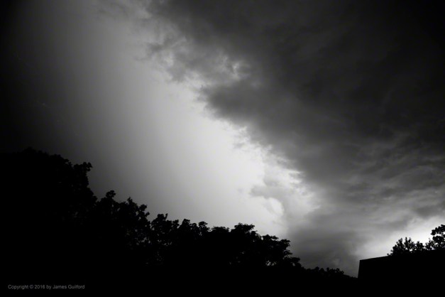 Photo: Intense hidden lightning illuminates the sky. Photo by James Guilford.