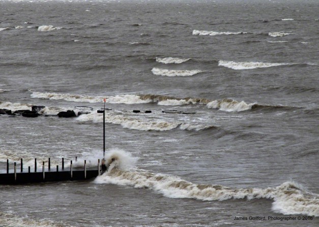 Photo: Breakwall is Pummeled by Wind-Driven Waves. Photo by James Guilford.