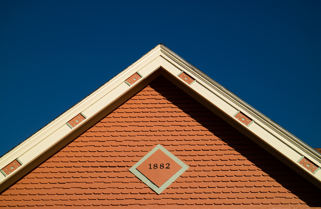 Photo: Gable of a house in Medina, Ohio against an intensely blue sky. Photo by James Guilford.