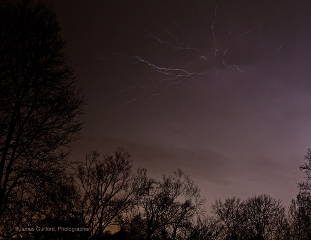 Lightning arcs in March Thunderstorm Bursting forth and spreading along the underside of the cloud - a "crawler." Photo by James Guilford.