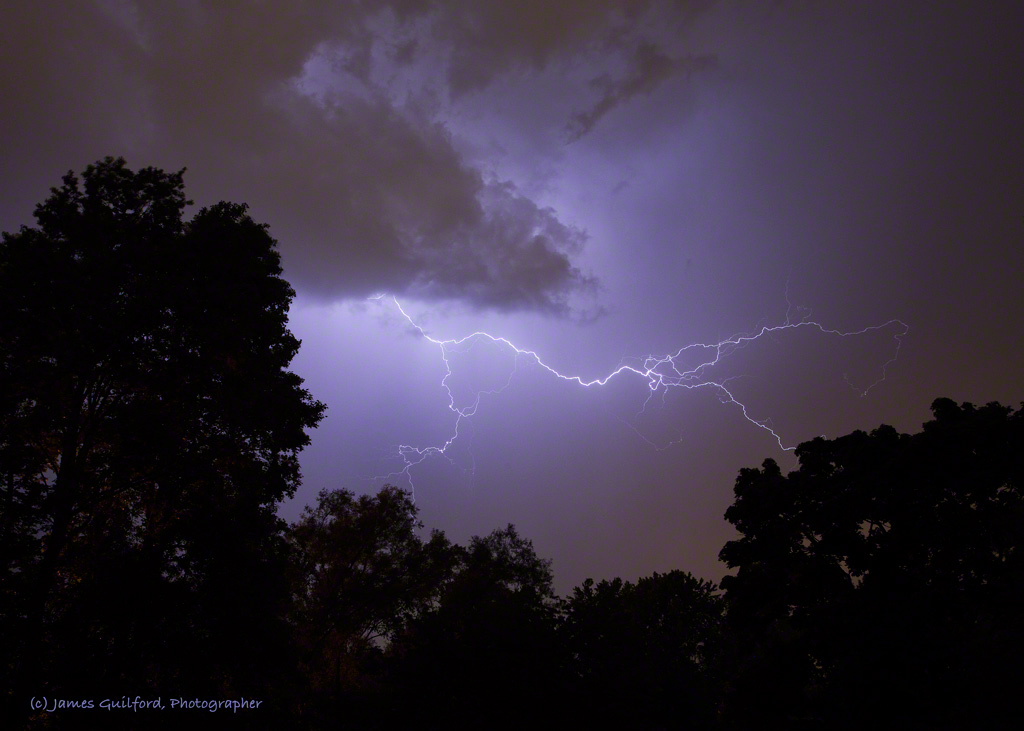 Photo: Bolts in the Blue. A nearby thunderstorm fills the sky with lightning. Photo by James Guilford.