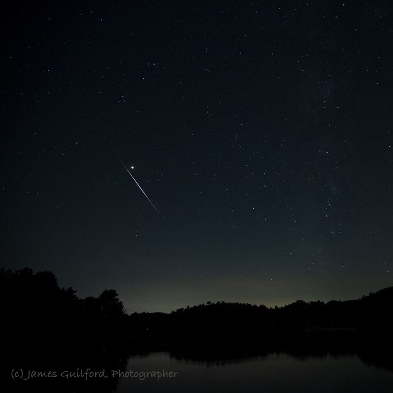 Photo: Sword of Mars: A bright Perseid meteor streaks to the left of planet Mars. Photo by James Guilford.