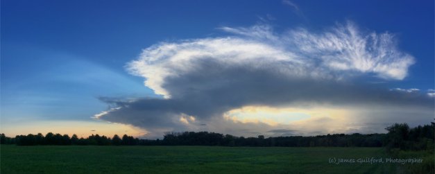Photo: Thunderbird. Clouds of the approaching storm spread across the western sky. Photo by James Guilford.