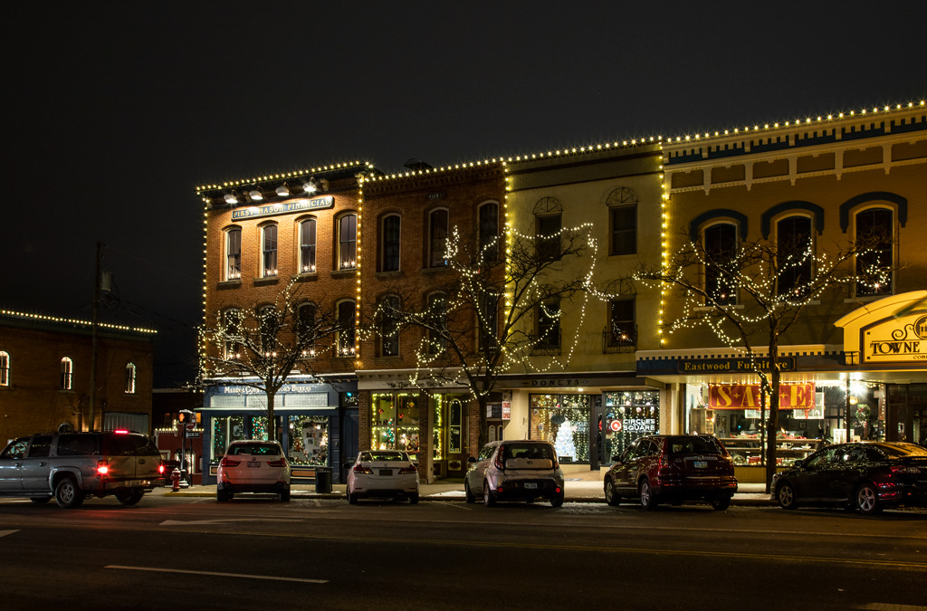 Photo: Buildings along North Court Street, Medina, Ohio, are outlined in lights with windows dressed for the holiday season. Photo by James Guilford.