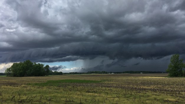Photo: A gust front rolls over open farm land ushering in a cold air mass and heavy rain. Photo by James Guilford.