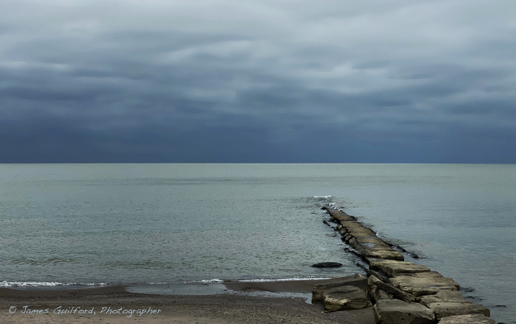Photo: Dark horizon, glowing Lake Erie Waters. Photo by James Guilford.